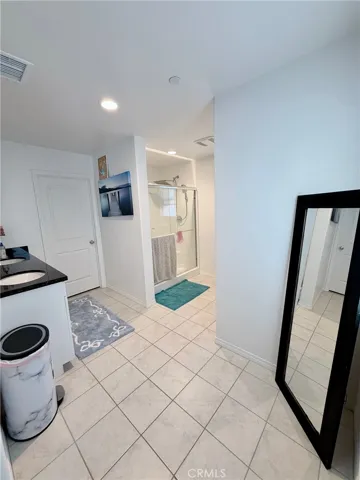 IN MASTER SUITE WALKING BEDROOM