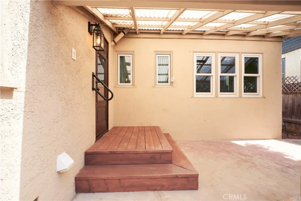 Back porch to covered patio and backyard
