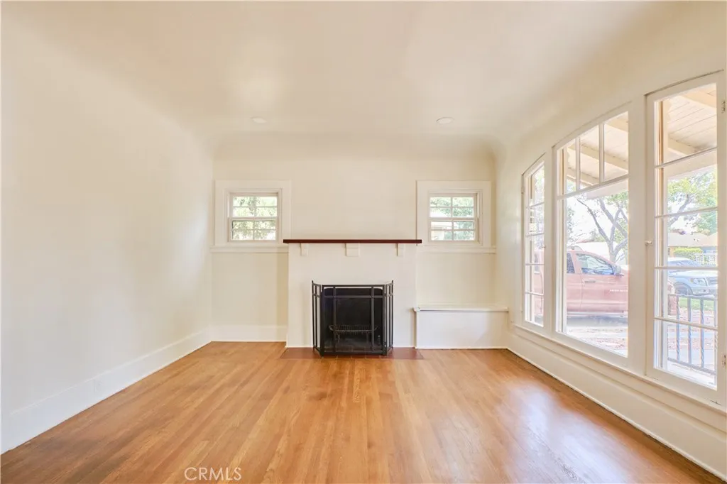 Living space, fireplace, and recessed lighting