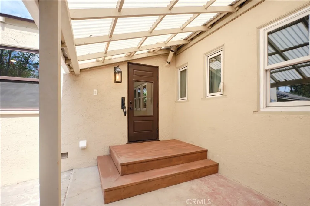 Back porch to covered patio and backyard