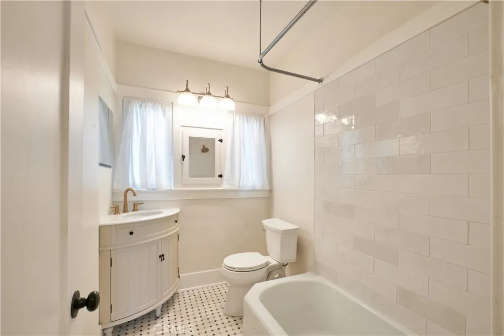 Bathroom new tile, new toilet, new sink, faucets
