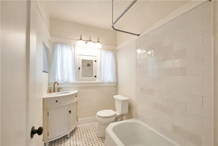 Bathroom new tile, new toilet, new sink, faucets