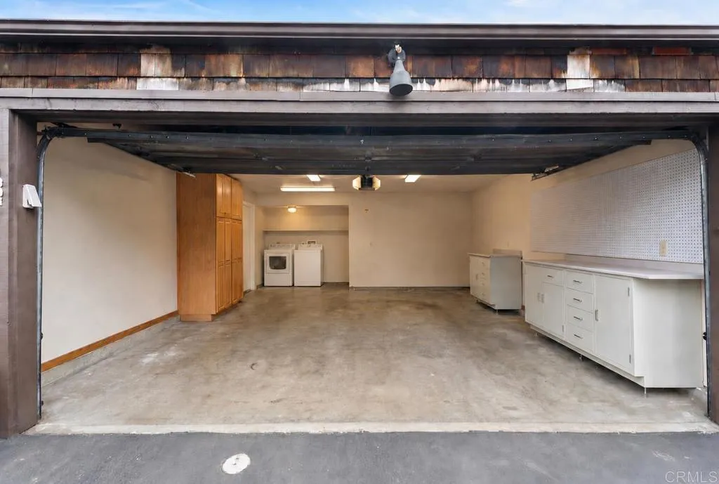 Two Car Attached Garage + Storage and Laundry