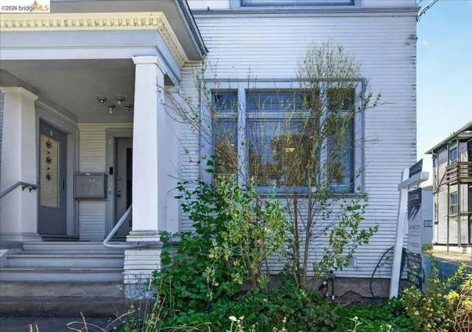Traditional architectural style featuring horizontal siding and multiple windows