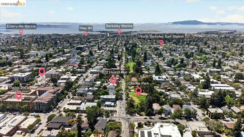 Aerial perspective showcasing a residential area with varied architecture, mature trees, and street infrastructure
