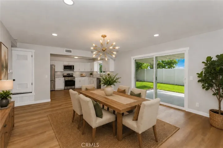 Bright dining space overlooking the backyard and patio.