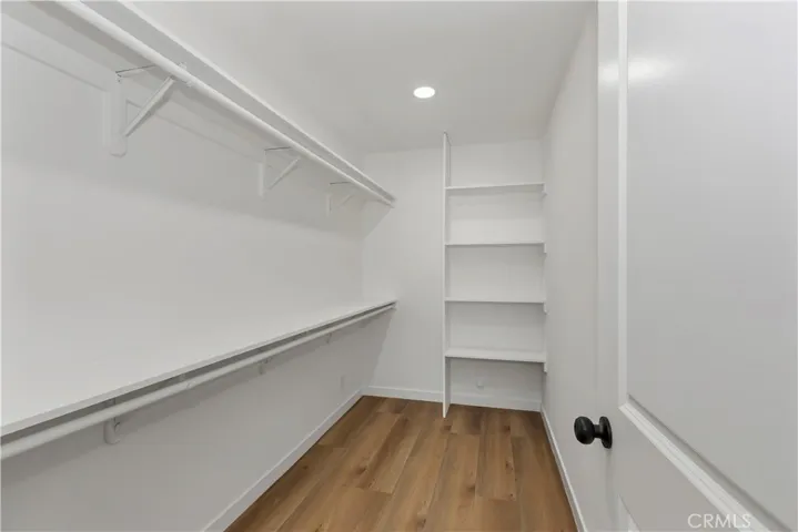 Spacious walk-in closet offering exceptional storage and organization.