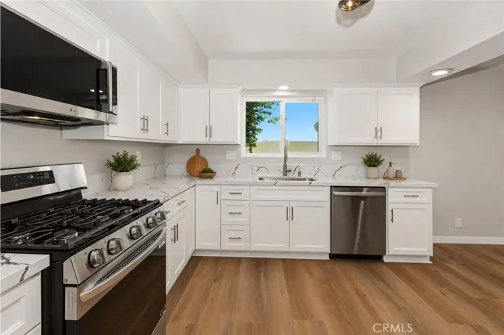 Remodeled kitchen showcasing stylish finishes and functional design.