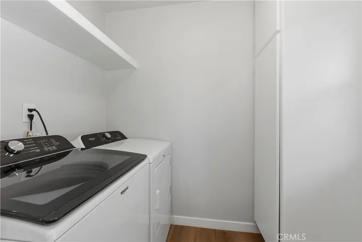 Dedicated indoor laundry room for added convenience.