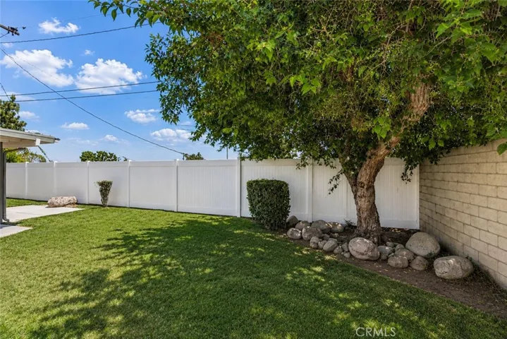 Private backyard with lawn area.