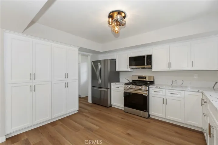 Ample storage and workspace make this kitchen both beautiful and practical.