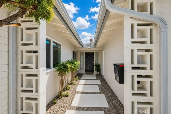 Private courtyard entry creating a warm and welcoming first impression.