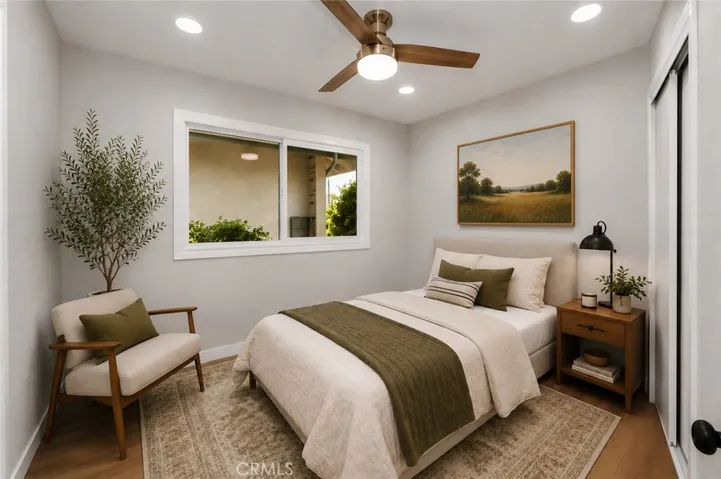 Comfortable secondary bedroom filled with natural light.