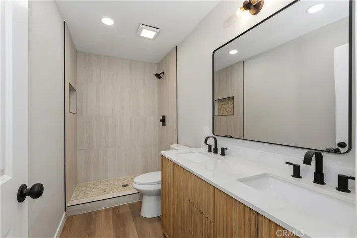 Updated primary bathroom with modern finishes and a walk-in shower.