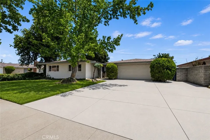 Front exterior highlighting mature landscaping and pride of ownership.