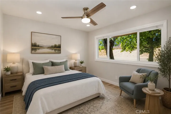 Spacious bedroom with abundant natural light and versatile living space.
