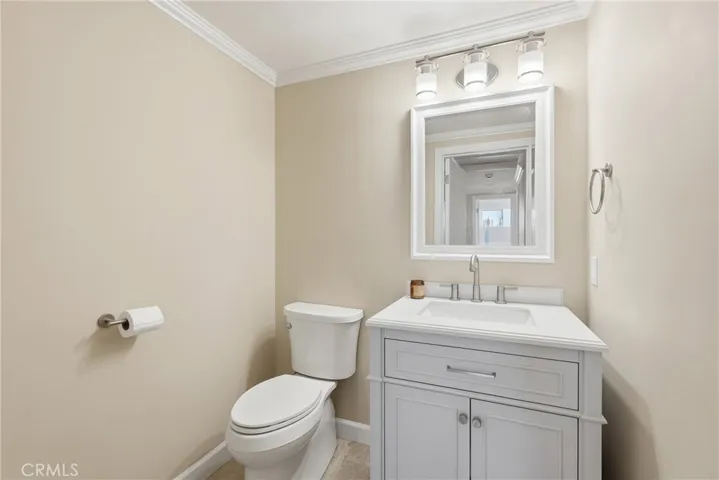 Powder room in hall, serves as a guest bath