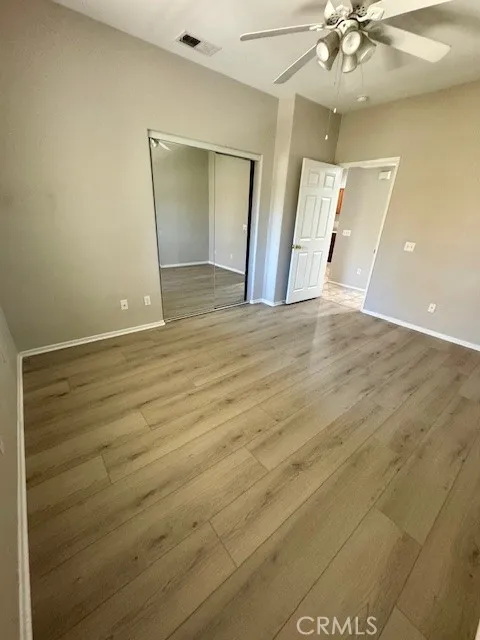 bedroom with mirror closet door