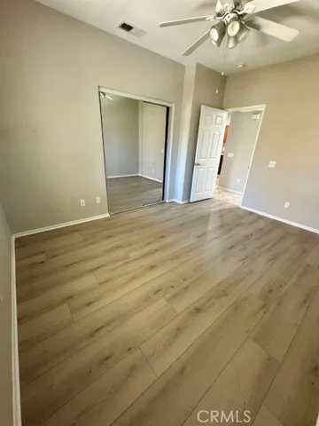bedroom with mirror closet door