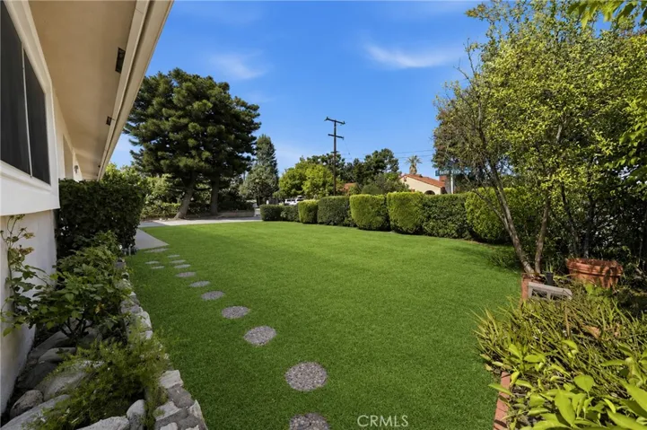 Front yard lawn has been virtually enhanced to show aesthetic potential