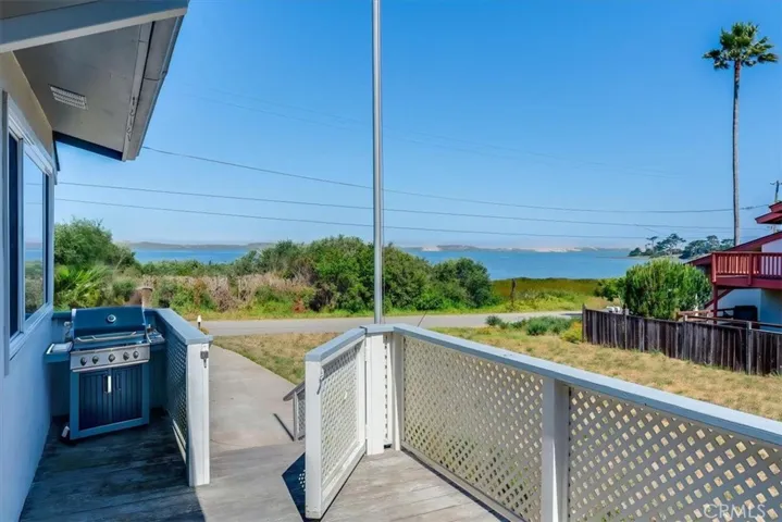 Virtually enhanced front side deck with BBQ.