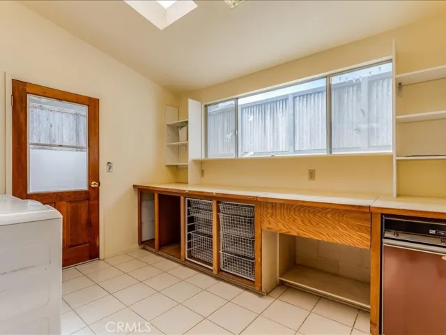 Large pantry/ utility area off of the kitchen with skylights. This area would also make a great craft room.