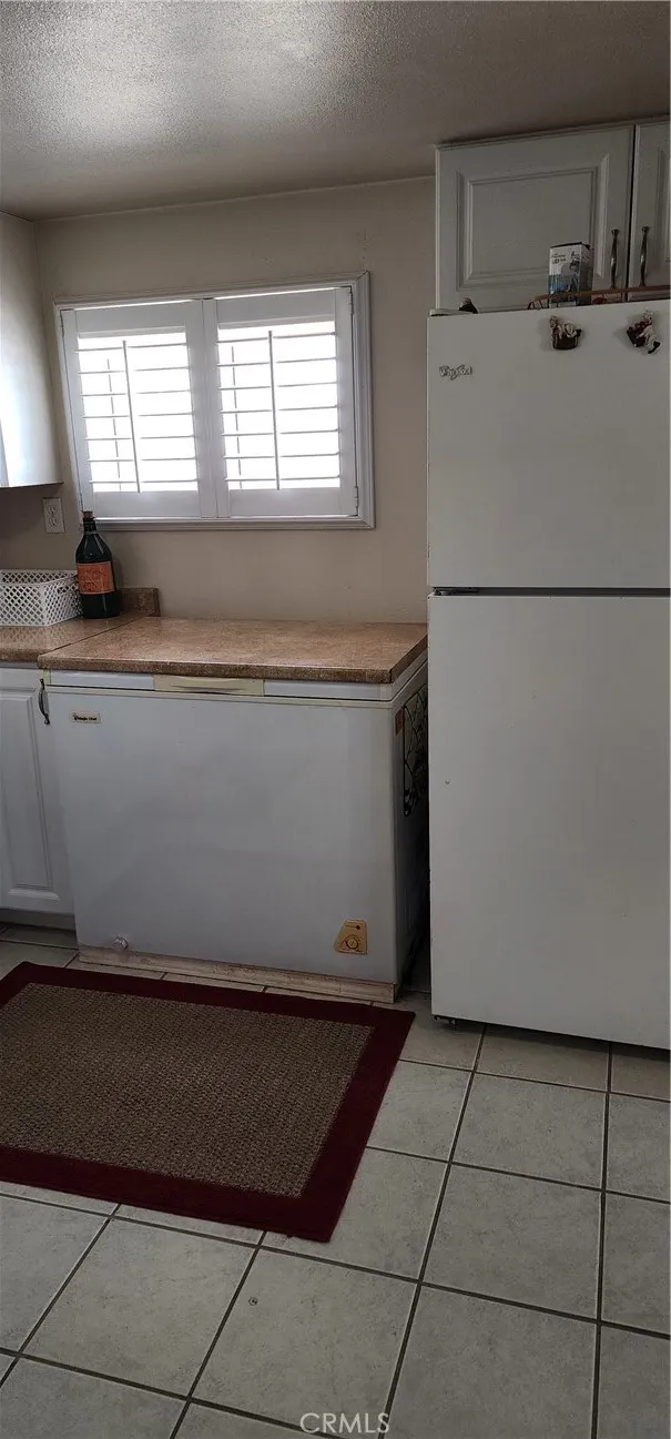 Casita kitchen has a refrigerator and separate deep freezer