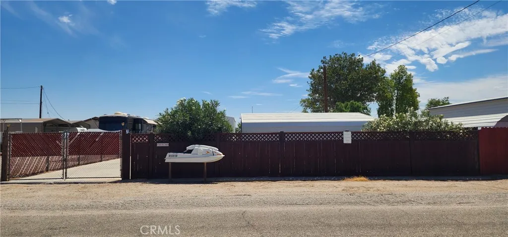 Street view of the back gate and jet ski mailbox