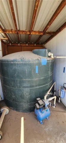 1,000 gallon water storage tank services both houses