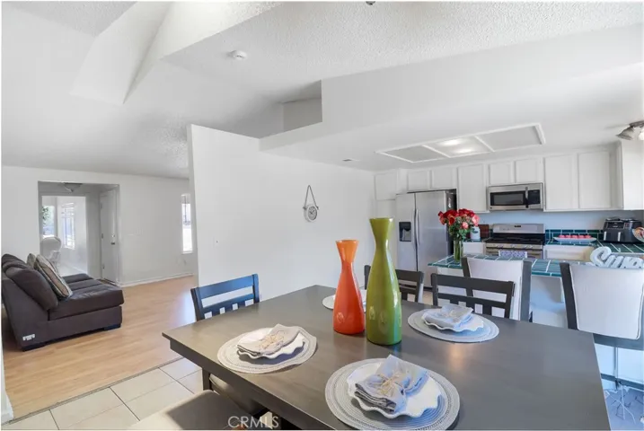 View of Dining Room Looking Into Kitchen and Living Room