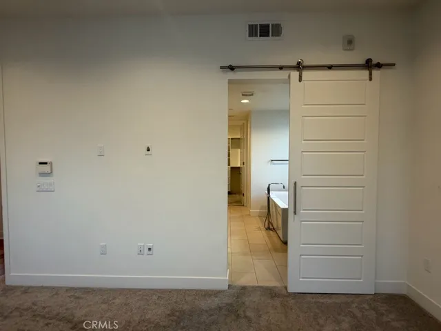 Barn door to master bathroom