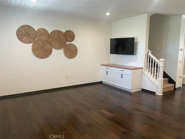 TV in Living room , with wood floor