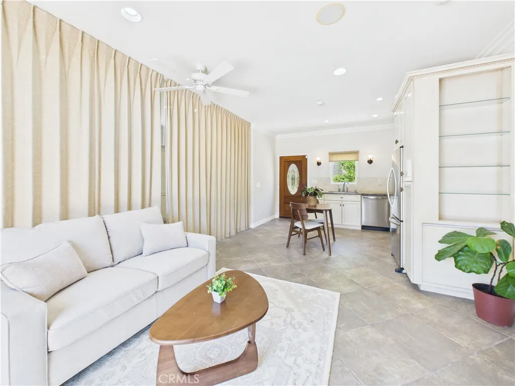 Privacy Curtain splitting built-in murphy bed room with bathroom from the living room and kitchen.