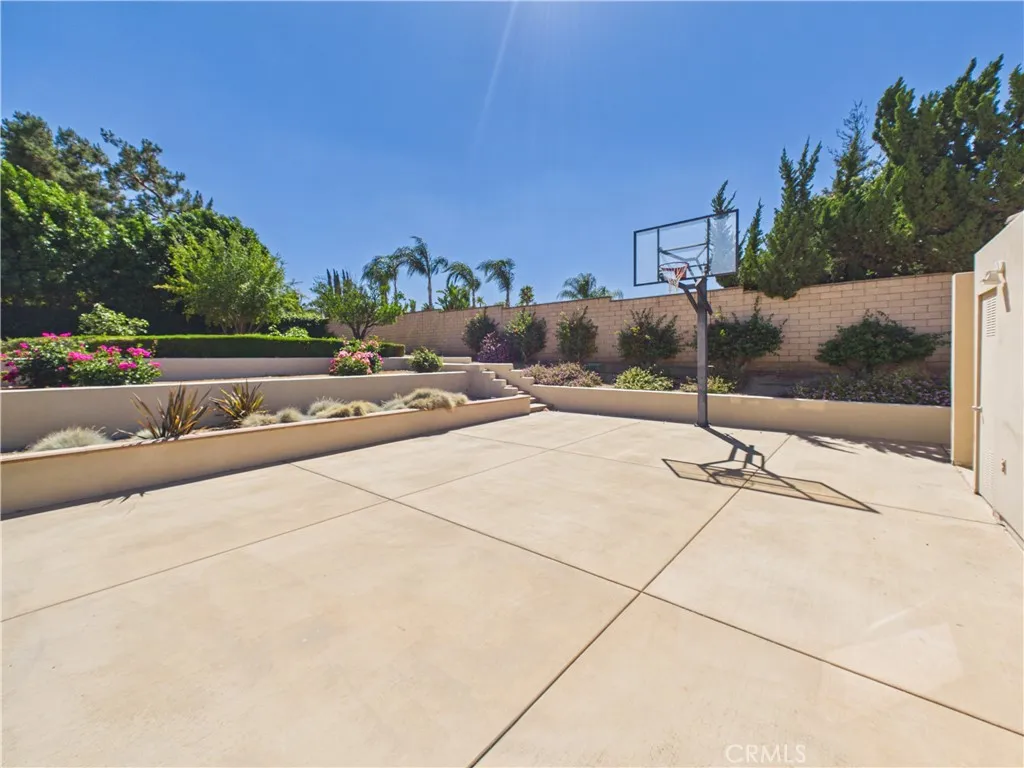 Half-court basketball and outdoor shower.