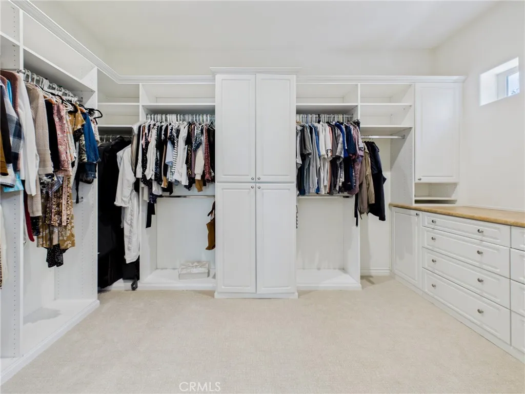 Walk-in closet with custom built-in system.