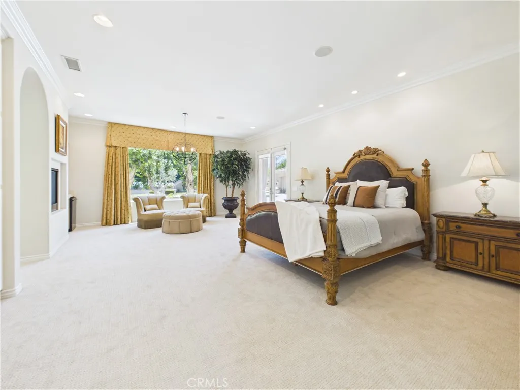 Huge primary suite with sitting room that opens out onto the covered lanai.
