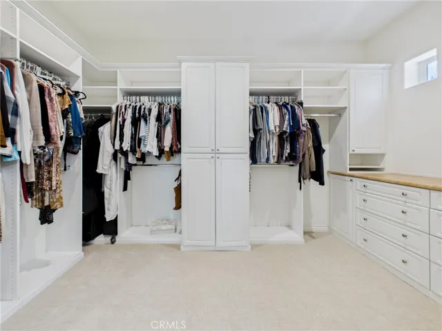 Walk-in closet with custom built-in system.