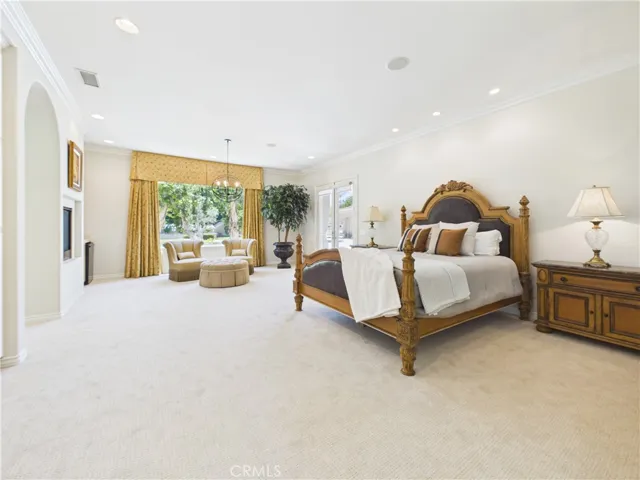 Huge primary suite with sitting room that opens out onto the covered lanai.