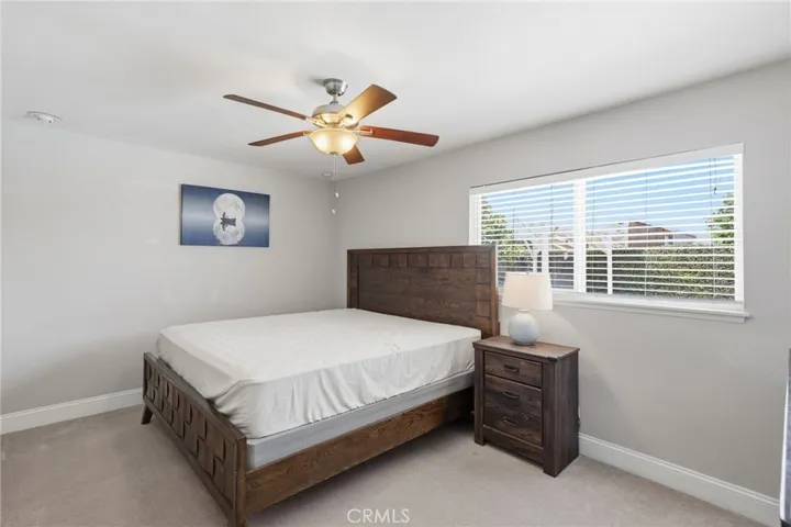 One of the two primary suites features an ensuite bathroom and walk-in closet, making this home ideal for multi-generational living, extended family, guests, or those seeking additional privacy.