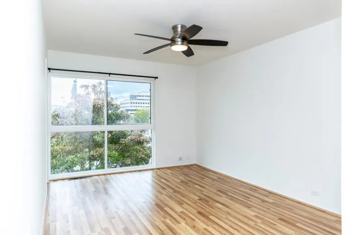 Ensuite primary room with walk-in closet