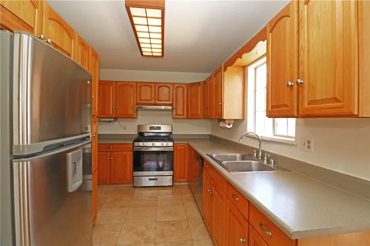Kitchen with plenty of cabinetry and stainless steel appliances.