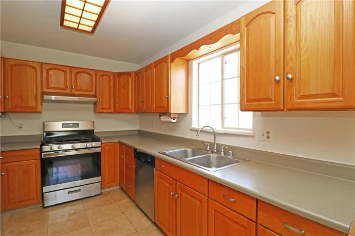 Kitchen with plenty of cabinetry and stainless steel appliances 2.