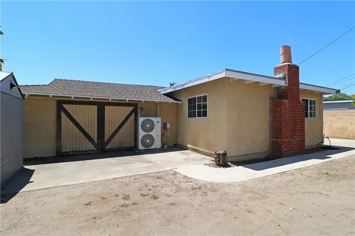 Barn doors open to the garage.
