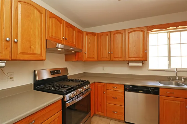 Kitchen with plenty of cabinetry and stainless steel appliances 3.