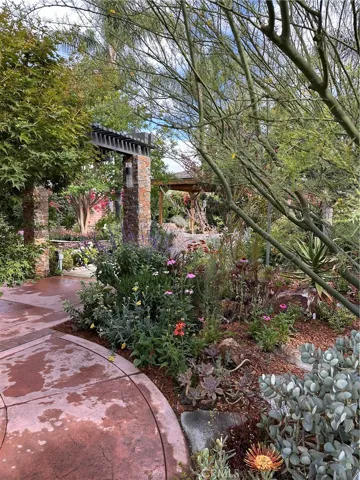 What a fantastic way to enter a lovely backyard!
