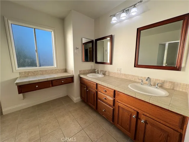 Master bathroom featuring a double vanity sink.