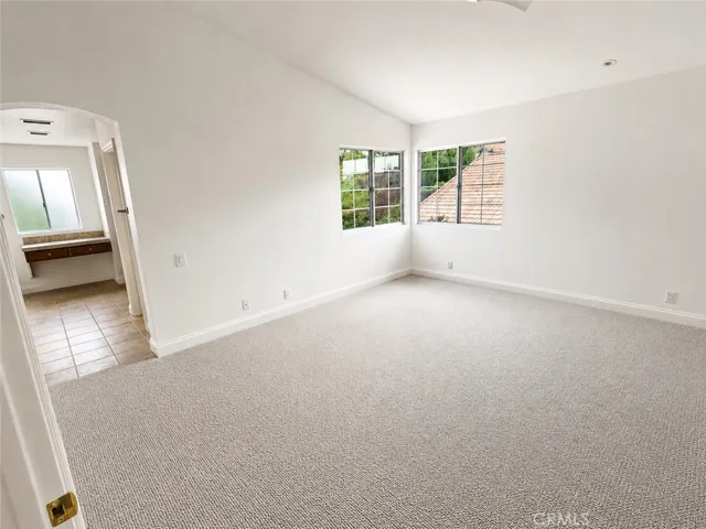 Spacious master bedroom with plenty of natural light and room for a sitting area.