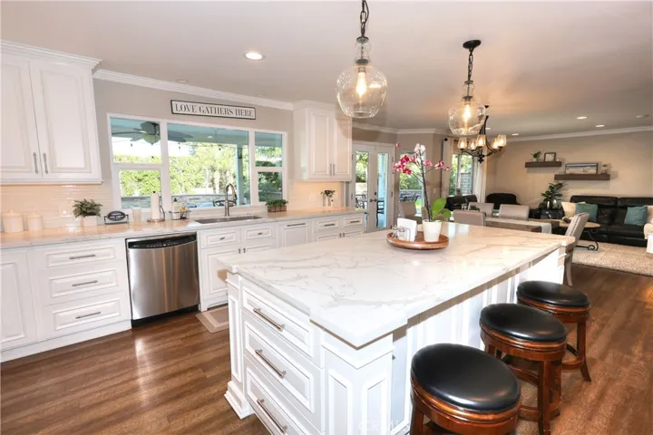 6 seats around large quartz island with storage