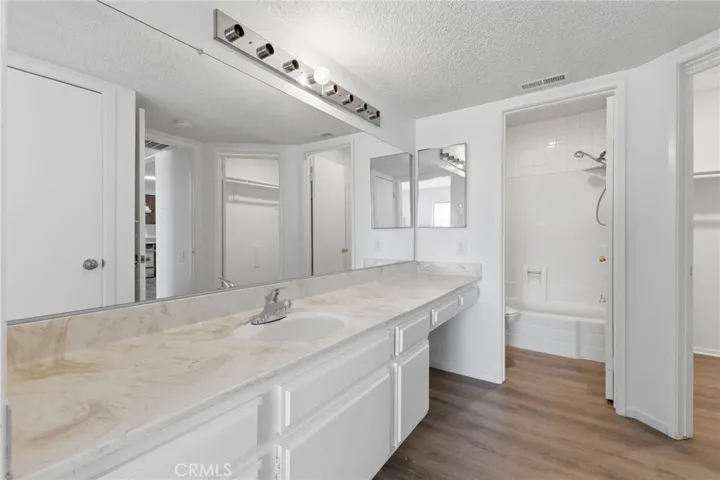Bathroom: double vanities. With separate room for toilet and shower