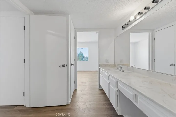 Bathroom: double vanities. With separate room for toilet and shower